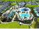 Aerial view of resort-style waterpark with slides, pools, and amenities at 408 Southfield St, Kissimmee, FL 34747
