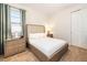 Comfortable bedroom featuring a queen bed, nightstands, and light-blocking curtains at 408 Southfield St, Kissimmee, FL 34747