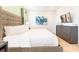 Spacious bedroom featuring a king bed, contemporary decor, and a wall-mounted television at 408 Southfield St, Kissimmee, FL 34747