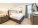 Cozy bedroom with a plush bed, bedside table, and soft natural light for a peaceful retreat at 408 Southfield St, Kissimmee, FL 34747