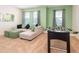 Recreation room featuring a cozy sofa, plush ottomans, and foosball for fun and entertainment at 408 Southfield St, Kissimmee, FL 34747