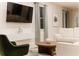 Living room features modern decor, comfortable seating, and a wall-mounted TV at 408 Southfield St, Kissimmee, FL 34747