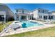 Private pool and spa with covered patio and outdoor dining at 408 Southfield St, Kissimmee, FL 34747