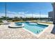 Beautiful pool with attached spa and poolside lounge chairs at 408 Southfield St, Kissimmee, FL 34747