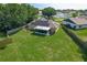Aerial view of the home showcasing the large backyard, screened patio, and neighborhood at 439 Lake Daisy Dr, Winter Haven, FL 33884