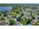 Panoramic aerial view of a lakeside neighborhood showing houses, trees, and a picturesque lake at 439 Lake Daisy Dr, Winter Haven, FL 33884