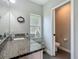 Bathroom featuring granite counters and a view into a separate toilet room at 439 Lake Daisy Dr, Winter Haven, FL 33884