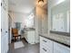 Bathroom featuring granite counters, large mirror, and glass shower at 439 Lake Daisy Dr, Winter Haven, FL 33884