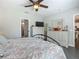 Comfortable bedroom featuring neutral walls, a ceiling fan, and dresser with a mirror at 439 Lake Daisy Dr, Winter Haven, FL 33884