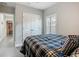 Cozy bedroom with plantation shutters and easy access to adjacent rooms at 439 Lake Daisy Dr, Winter Haven, FL 33884