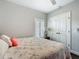 Cozy bedroom featuring a seashell-themed comforter, bright natural light, and neutral wall paint at 439 Lake Daisy Dr, Winter Haven, FL 33884