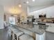 Bright kitchen with granite counters and stainless steel appliances at 439 Lake Daisy Dr, Winter Haven, FL 33884