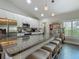 Kitchen island with seating boasts granite countertops and provides ample space for food prep and entertaining at 439 Lake Daisy Dr, Winter Haven, FL 33884