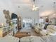 Open-concept living room with kitchen and lanai view at 439 Lake Daisy Dr, Winter Haven, FL 33884