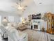 Spacious living room with vaulted ceiling and fireplace at 439 Lake Daisy Dr, Winter Haven, FL 33884