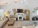 Bright living room features a fireplace, vaulted ceilings, and neutral decor at 439 Lake Daisy Dr, Winter Haven, FL 33884