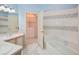 Bright bathroom featuring a tub, vanity, and tile flooring design at 4823 Shoreline Cir, Sanford, FL 32771