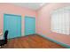 Bedroom with wooden floors, ample closet space, and a bright, airy feel at 4823 Shoreline Cir, Sanford, FL 32771