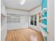 Custom designed walk in closet with wooden floors, drawers, shelves, and hanging storage at 4823 Shoreline Cir, Sanford, FL 32771