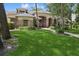 Inviting home with well-maintained lawn, brick exterior, and a welcoming front entryway at 4823 Shoreline Cir, Sanford, FL 32771