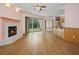 Spacious living room with fireplace, bar top, and vinyl flooring at 4823 Shoreline Cir, Sanford, FL 32771
