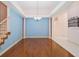 Spacious Living Room with hardwood floors and elegant columns at 4823 Shoreline Cir, Sanford, FL 32771