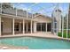 Beautiful pool with patio and seating area, great for entertaining guests at 4823 Shoreline Cir, Sanford, FL 32771