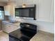 Close-up of the kitchen showing appliances and cabinetry at 49 Orange Park Blvd, Lake Wales, FL 33898