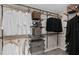 Walk-in closet with ample storage, metal racks, and organized shelving for clothing and accessories at 5039 Starling Bird Ln, St Cloud, FL 34771
