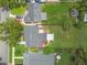 Aerial view of home with mature landscaping, fenced backyard, and a well-maintained lawn at 536 W King St, Orlando, FL 32804