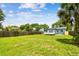 Spacious backyard featuring a lush lawn and a small house with a deck at 536 W King St, Orlando, FL 32804