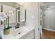 Modern bathroom featuring a sink vanity, matte black faucet, and ample lighting at 536 W King St, Orlando, FL 32804