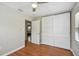 Bedroom features hardwood floors, neutral paint, and a large closet at 536 W King St, Orlando, FL 32804