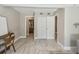 Bedroom with wood-look tile flooring and view into other rooms at 536 W King St, Orlando, FL 32804