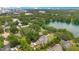 Stunning aerial view of a lakefront property in a lush, green setting, showcasing both natural beauty and urban convenience at 614 Lake Ave, Orlando, FL 32801
