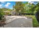 Spacious backyard with concrete patio, basketball court, and fenced-in perimeter at 614 Lake Ave, Orlando, FL 32801