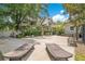 Expansive backyard featuring a patio, lounge chairs, and lush landscaping offers relaxation and entertainment space at 614 Lake Ave, Orlando, FL 32801