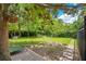 Secluded backyard features lush landscaping, decorative garden elements, and a private, serene setting at 614 Lake Ave, Orlando, FL 32801