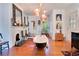 Spacious bathroom featuring a standalone tub, fireplace, unique decor, and hardwood floors at 614 Lake Ave, Orlando, FL 32801