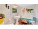 Charming bathroom with pedestal sink, colorful accents, and vintage-inspired fixtures, creating a unique and playful space at 614 Lake Ave, Orlando, FL 32801