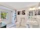 Bright bathroom with wainscoting, subway tile shower, and black-and-white mosaic floor at 614 Lake Ave, Orlando, FL 32801