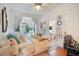 Spacious bedroom with a cozy bed, soft textures, and view of the connecting bathroom with natural light, creating a serene retreat at 614 Lake Ave, Orlando, FL 32801