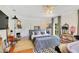 Large bedroom with fireplace, sitting area, hardwood floors, and modern decor at 614 Lake Ave, Orlando, FL 32801