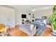 Spacious bedroom featuring a sitting area, closet, hardwood floors, and modern decor at 614 Lake Ave, Orlando, FL 32801