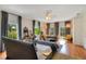 Large bedroom with sitting area, hardwood floors, large windows, and modern decor at 614 Lake Ave, Orlando, FL 32801