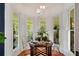 Charming breakfast nook with bright windows and unique table setting at 614 Lake Ave, Orlando, FL 32801