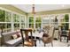 Bright breakfast nook with a chandelier, cushioned banquette seating, and plenty of natural light at 614 Lake Ave, Orlando, FL 32801