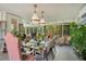 Dining area surrounded by windows with glass table, seating and pendant lighting at 614 Lake Ave, Orlando, FL 32801