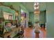 Bright foyer showcasing green walls, hardwood floors, ornamental lighting, and an entryway to a neighboring room at 614 Lake Ave, Orlando, FL 32801