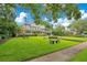 Attractive two-story home with well-maintained lawn and mature trees offers beautiful curb appeal at 614 Lake Ave, Orlando, FL 32801